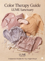 Artistic flat lay of LUME SANCTUARY silk collection in pink, blue, and ivory with vibrant color therapy paint strokes on a minimalist background.